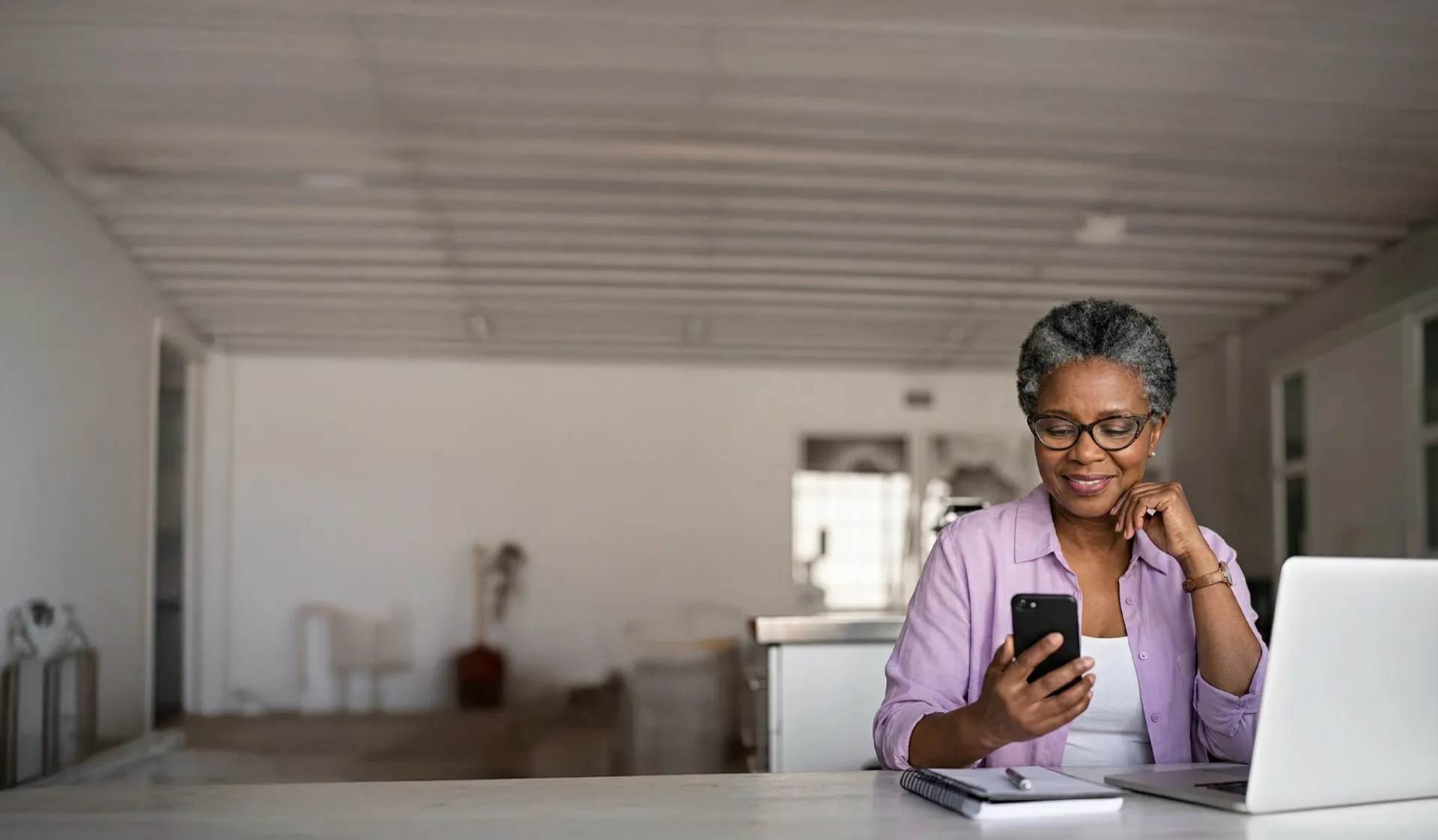 A patient using her phone at home