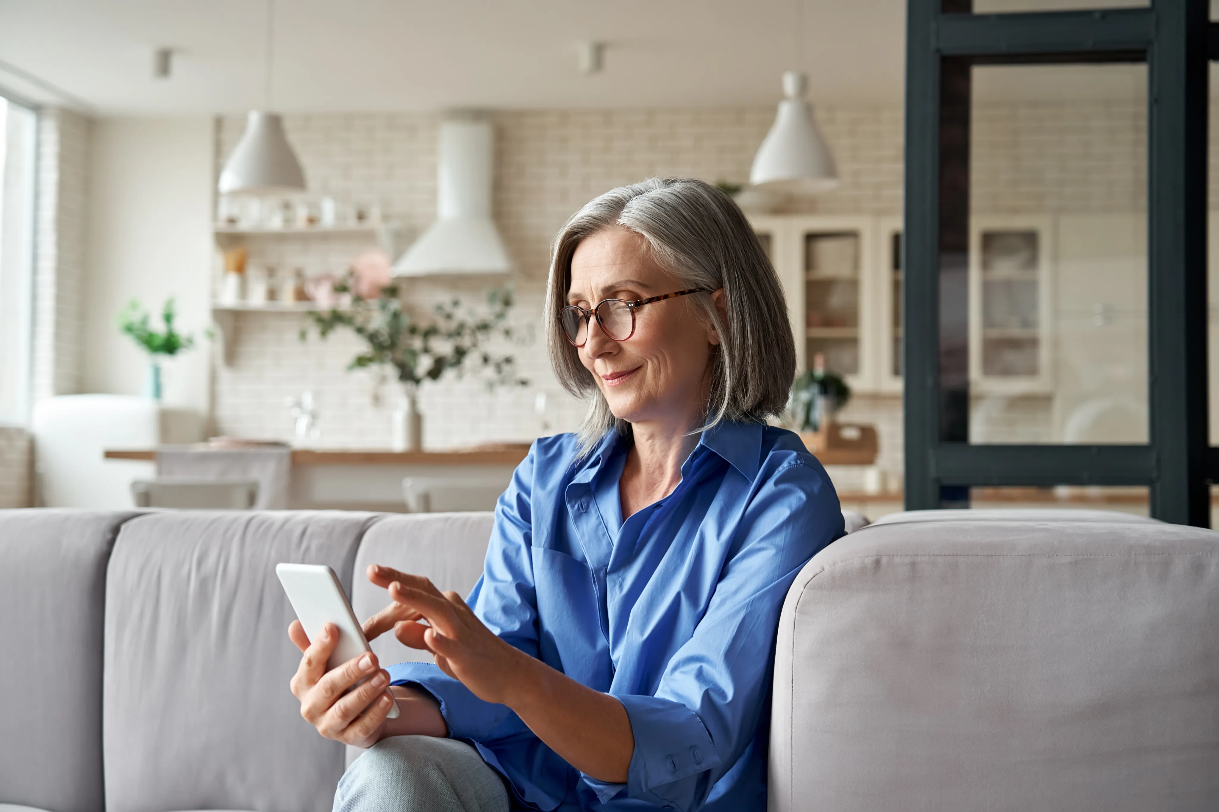 A patient at home reads an update from Allie on her phone